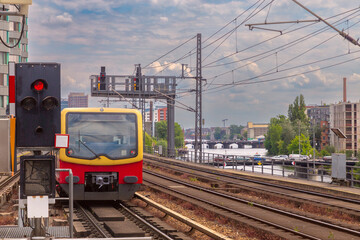 Yellow carriages of the famous Berlin metro on a sunny day.