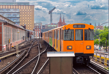 Yellow carriages of the famous Berlin metro on a sunny day.