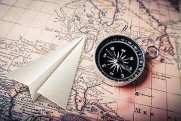 Toy paper model plane on map