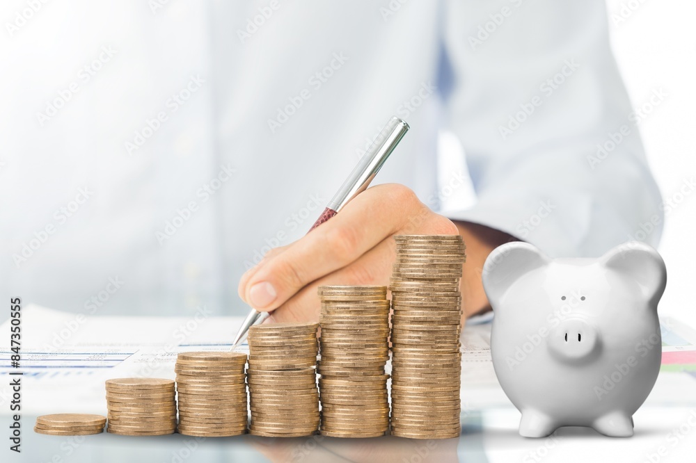 Wall mural person with pile coins and small piggy bank