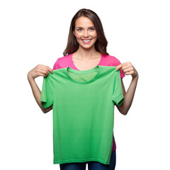 Fototapeta premium Smiling woman holding green shirt in front on transparent background