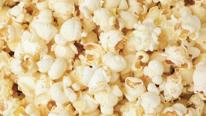 Popcorn stop motion video. Popcorn changing background. Junk food or snack 4K resolution video banner