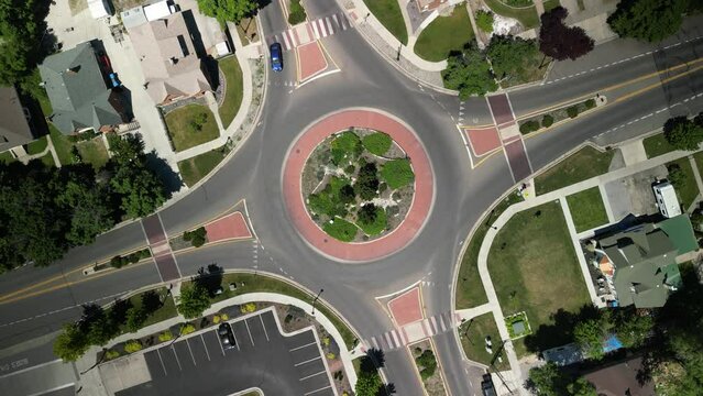 Top down aerial of cars in round a bout in Logan Utah