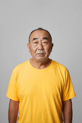 Serious Man in Yellow T-Shirt