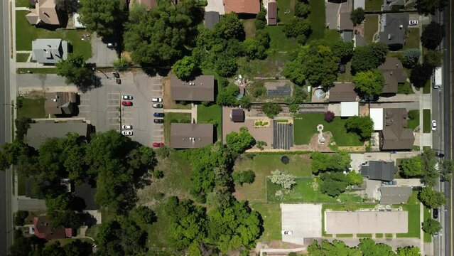 Top down aerial over suburban homes in Logan Utah in spring
