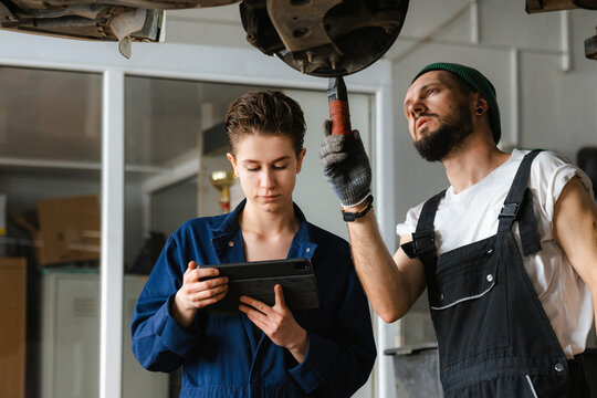 A group of people working in an auto repair shop