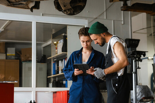A group of people working in an auto repair shop