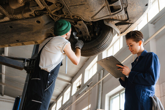 A group of people working in an auto repair shop