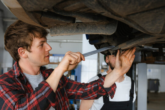 A group of people working in an auto repair shop
