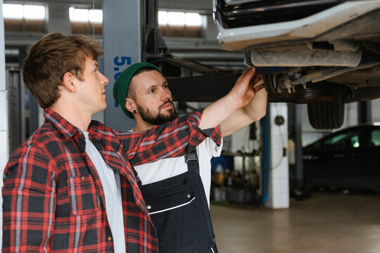 A group of people working in an auto repair shop