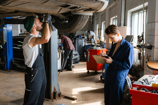 A group of people working in an auto repair shop