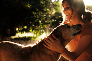 woman petting her dog