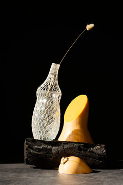 Half cut butternut squash on black background