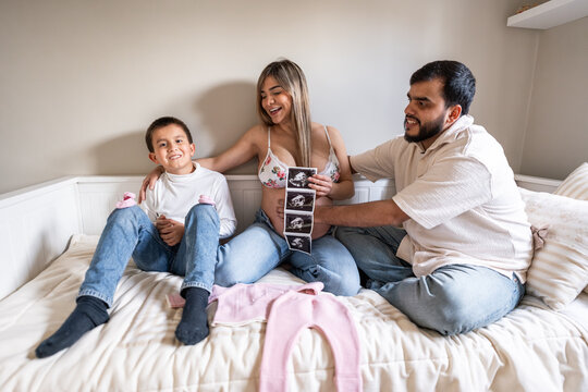 Family with baby ultrasound.