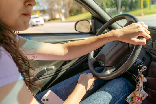 young woman driving her car 