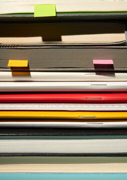 Set of various notebooks and journals with colorful vivid bookmarks. 