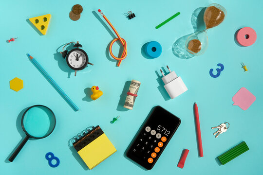 Flat lay of office and business supplies on blue background