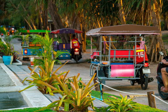 tricycles on sunset beach road