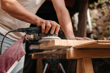 Carpenter sanding wood
