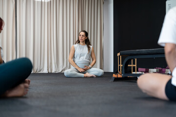 Yoga instructor leading meditation class