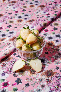 glass bowl with some pineberries