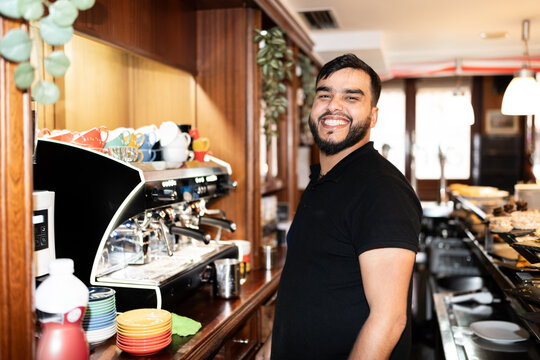 Smiling venezuelan bartender at work
