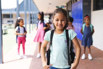Obraz premium Students with backpacks standing together, smiling and ready for school