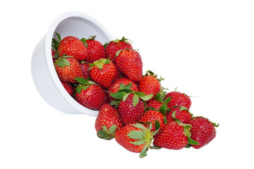 red strawberries pouring out of a white bowl isolated transparent