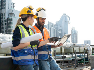 Male man female woman person people human computer notebook tablet digital technology look see watch copy space building real state teamwork group discussion work job occupation professional industry 