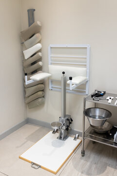 Prosthetic lab equipment is neatly organized on wall and metal cart