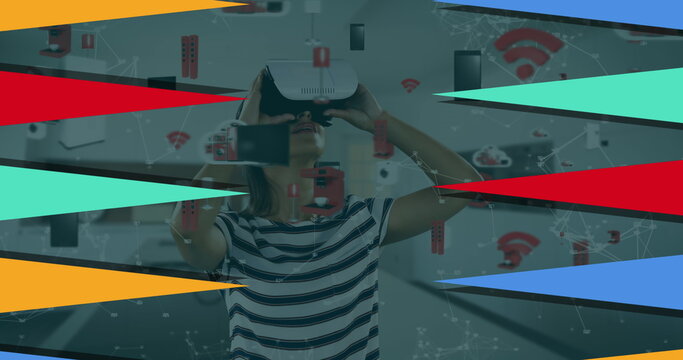 Image of geometrical shapes over biracial woman using vr headset