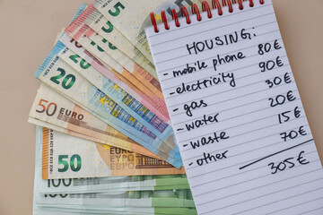 Counting receipt for utilities payment. Euro cash money bill. Electricity water gas price....