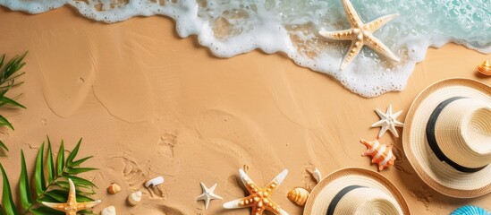 Sandy beach from above with summer items and free space for advertising or packaging.