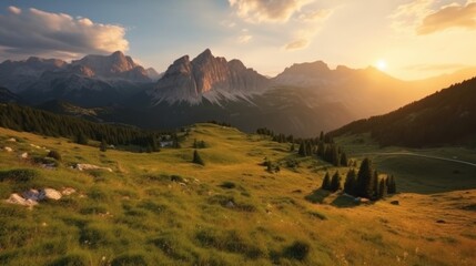 Panoramic view of mountains at sunset.The sun is low on the horizon, throwing warm light into the sky and illuminating the view with golden light