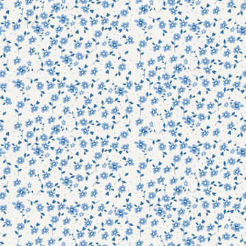 Floral seamless pattern with small blue flowers on a ivory white background 