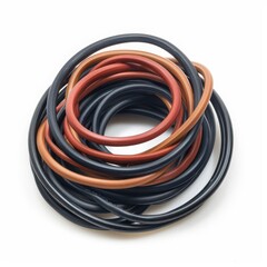 Coiled rubber tubing in various colors, used for various applications. Isolated on white background.