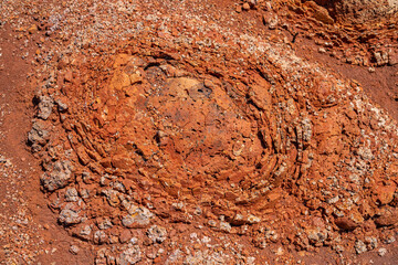 Spheroidal weathering basalt， Waimea Canyon Basalt / Napali Member / Lava flows, Kauai, Hawaii. Red soil. 
