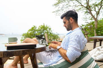 Caucasian businessman remote working online corporate business financial on laptop computer at...