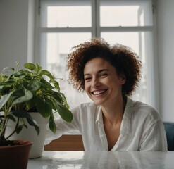 woman holding potted plant in greenhouse