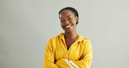 Portrait, smile or black woman with arms crossed, trendy or confident model on grey studio...