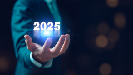 Businessman holding corporate future growth year 2025. Planning, opportunity, challenge and...
