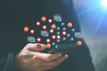 User playing Social media technology, Social media marketing concept hand using smartphone typing, chatting conversation in chat box icons pop up