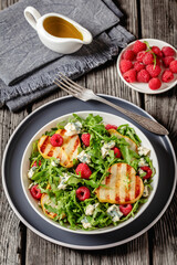 grilled pear salad with cheese, arugula, berries
