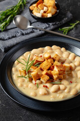 rosemary garlic creamy white bean soup in bowl