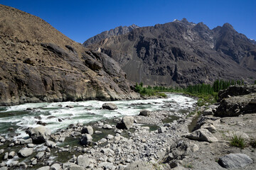 Khalti lake, situated approximately 6 km from Gupis along the Gilgit-Chitral Road, is a stunning natural attraction where the Gilgit river widens and deepens near Khalti village.