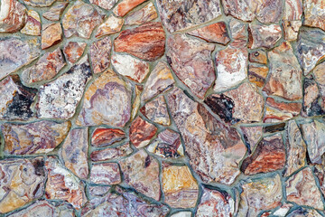 Abstract detail of the decorative stone wall on an old building