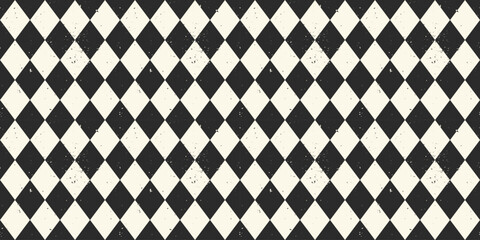 Distressed Diamond Check Pattern seamless background. Black and white Harlequin pattern with dirty texture. Pattern swatch is included.