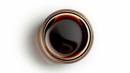 Soy sauce in a glass bowl, top-down perspective, with the rich, dark liquid reflecting the studio lights, isolated white background