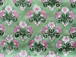 white and pink mughal floral butta on cotton green fabric