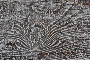Naklejka premium Weathered old wood plank creates interesting pattern around knot